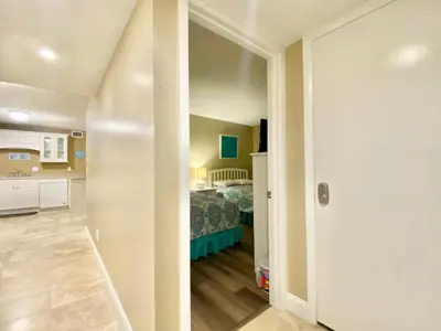 a kitchen and a bedroom with a bed in a room at Gulfgate 201 in Panama City Beach