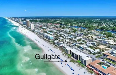 an aerial view of a beach with buildings and the ocean at Gulfgate 201 in Panama City Beach