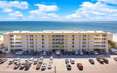 an aerial view of a hotel with cars parked in a parking lot at Gulfgate 201 in Panama City Beach