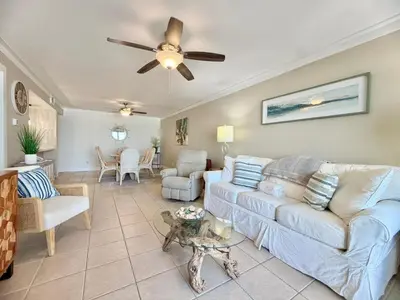 a living room with a couch and a ceiling fan at Gulfgate 204 in Panama City Beach