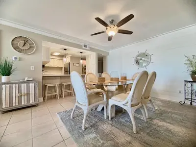 a dining room with a table and chairs at Gulfgate 204 in Panama City Beach