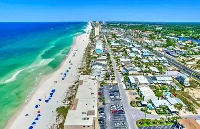 an aerial view of a beach with buildings and the ocean at Gulfgate 204 in Panama City Beach