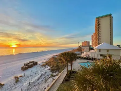 a view of the beach and the ocean at sunset at Pelican Walk 307 in Panama City Beach