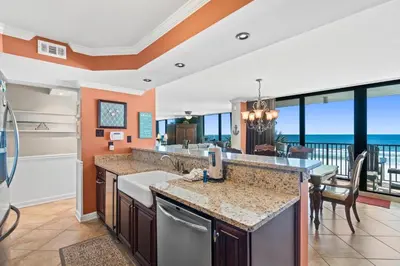 a kitchen with a view of the ocean at Pelican Walk 307 in Panama City Beach