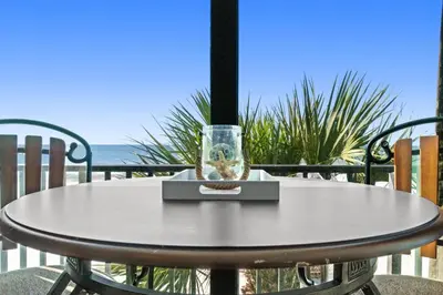 a table with a glass on top of it at Pelican Walk 307 in Panama City Beach