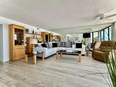 a living room with a couch and a table at Pelican Walk 207 in Panama City Beach