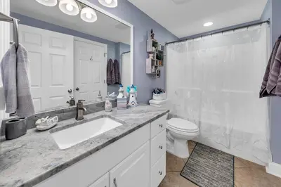 a bathroom with a sink and a shower and a toilet at Majestic Beach Towers 2-404 in Panama City Beach