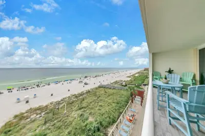 a view of the beach from the balcony of a beach house at Majestic Beach Towers 2-404 in Panama City Beach