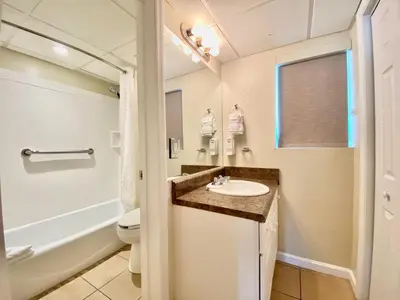 a bathroom with a sink and a toilet at Casa Blanca Resort Studio Loft in Panama City Beach