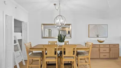 a dining room with a table and chairs at Treasure Island 1405 in Panama City Beach