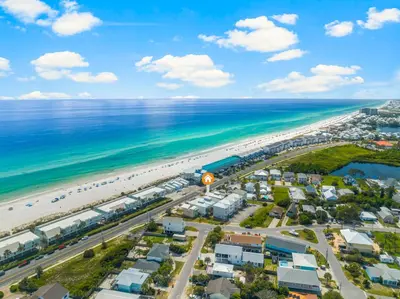 an aerial view of a beach and the ocean at 22704 Front Beach Road | Ocean Breeze in Panama City Beach