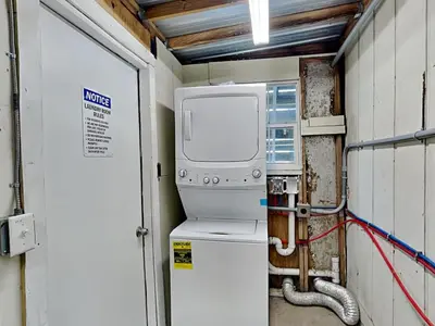 a small room with a boiler and a machine at PC Beach Retreat A in Panama City Beach