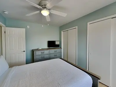 a bedroom with a bed and a ceiling fan at PC Beach Retreat C in Panama City Beach