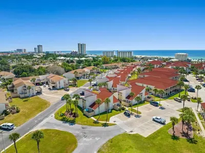 an aerial view of a community with houses and the ocean at Renovated Townhome 5 mins walk to Beach, in the best resort in PCB, Horizon South in Panama City Beach
