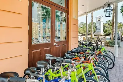 a row of bikes parked outside of a building at Relax Awhile - Carriage House in Panama City Beach