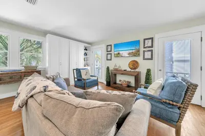 a living room with a couch and a television at Relax Awhile in Panama City Beach