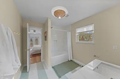 a bathroom with a shower and a bath tub at Happy to Sea You, Beach Access, Private Pool, Yard, Patio, Deck in Inlet Beach