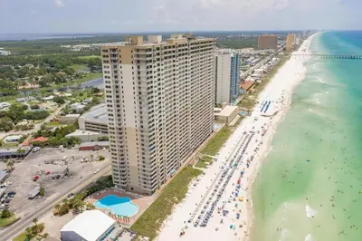 an aerial view of a beach with a large building at Stunning Beachfront Condo, Walk to Pier Park,Pools in Panama City Beach