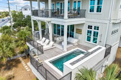 an aerial view of a house with a swimming pool at One Second Away in Santa Rosa Beach