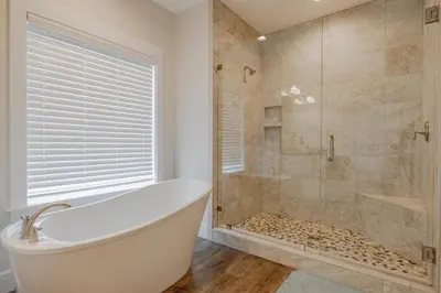 a bathroom with a bath tub and a shower at Southern Breeze - Private Pool - 100 Feet From The Beach! in Panama City Beach