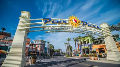 a gate at the entrance to the amusement park at Southern Breeze - Private Pool - 100 Feet From The Beach! in Panama City Beach