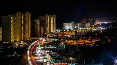 a city lit up at night with street lights at Southern Breeze - Private Pool - 100 Feet From The Beach! in Panama City Beach