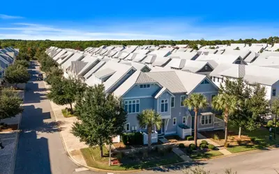 an aerial view of a row of houses with white roofs at 12 Milestone Dr C by Oversee 30A in Inlet Beach