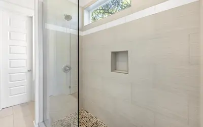a bathroom with a shower with a glass door at 91 San Juan by Oversee 30A in Santa Rosa Beach