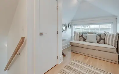 a living room with a couch and a window at 94 Pinecrest by Oversee 30A in Inlet Beach