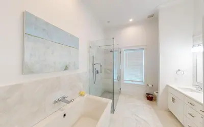 a white bathroom with a tub and a shower at 94 Pinecrest by Oversee 30A in Inlet Beach