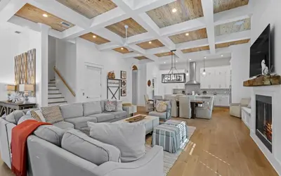 a living room with a couch and a fireplace at 94 Pinecrest by Oversee 30A in Inlet Beach