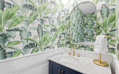 a bathroom with a large mural of tropical plants at After Dune Delight by Oversee 30A in Inlet Beach