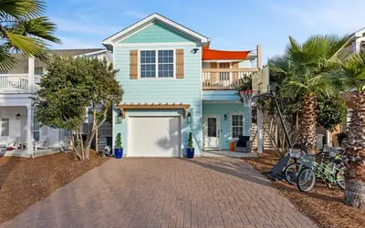 a blue house with a white garage at After Dune Delight by Oversee 30A in Inlet Beach