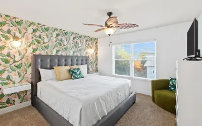 a bedroom with a bed and a ceiling fan at After Dune Delight by Oversee 30A in Inlet Beach