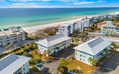 an aerial view of the beach and buildings at Aqua Bella by Oversee 30A in Santa Rosa Beach