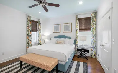 a bedroom with a bed and a ceiling fan at Beach Bike Bungaleaux by Oversee 30A in Seacrest