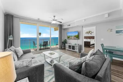a living room with a view of the ocean at Shores of Panama Chic 2-BD Beachfront Resort Condo! by Dolce Vita Getaways! in Panama City Beach
