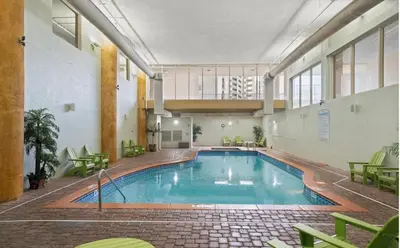 a large swimming pool in a large building at Shores of Panama Chic 2-BD Beachfront Resort Condo! by Dolce Vita Getaways! in Panama City Beach
