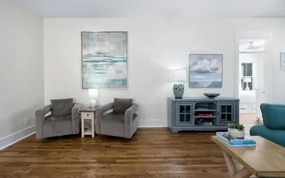 a living room with two chairs and a table at Beach Dreamer by Oversee 30A in Seacrest
