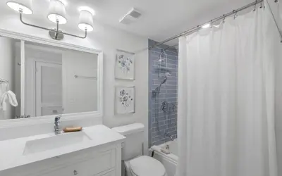 a bathroom with a sink and a toilet and a shower at Beachfront Oasis by Oversee 30A in Panama City Beach