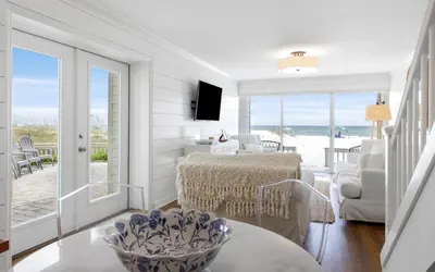a living room with a view of the ocean at Beachfront Oasis by Oversee 30A in Panama City Beach