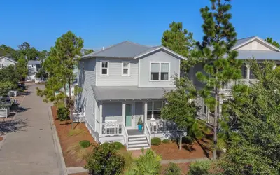 an aerial view of a white house with a porch at Flatwoods 134 by Oversee 30A in Santa Rosa Beach