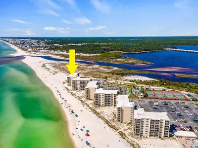 an aerial view of a beach with a yellow arrow at Top Shellf by Oversee 30A in Carillon Beach