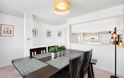 a dining room with a table and chairs at Ocean Breezes by Oversee 30A in Carillon Beach