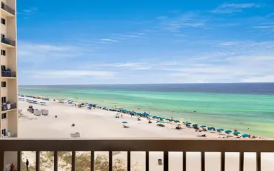 a view of a beach with umbrellas and the ocean at Drift on Inn by Oversee 30A in Carillon Beach