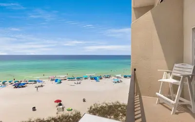 a view of the beach from the balcony of a condo at Drift on Inn by Oversee 30A in Carillon Beach
