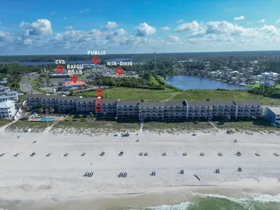 an aerial view of a beach with a resort at The Little Round Up by Oversee 30A in Panama City Beach