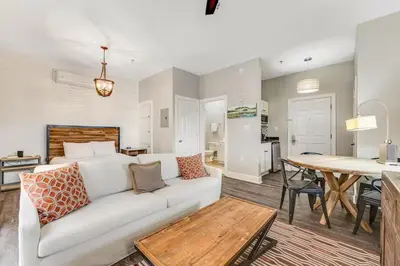 a living room with a white couch and a table at Village of South Walton B248 by Oversee 30A in Inlet Beach