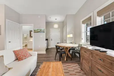 a living room with a white couch and a table at Village of South Walton B248 by Oversee 30A in Inlet Beach