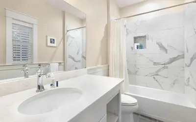 a white bathroom with a sink and a toilet at Casa De La Sirena by Oversee 30A in Seacrest